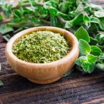 A Scientific Look at Oregano’s Role in Supporting Wellness Fresh and dried oregano herb on wooden background